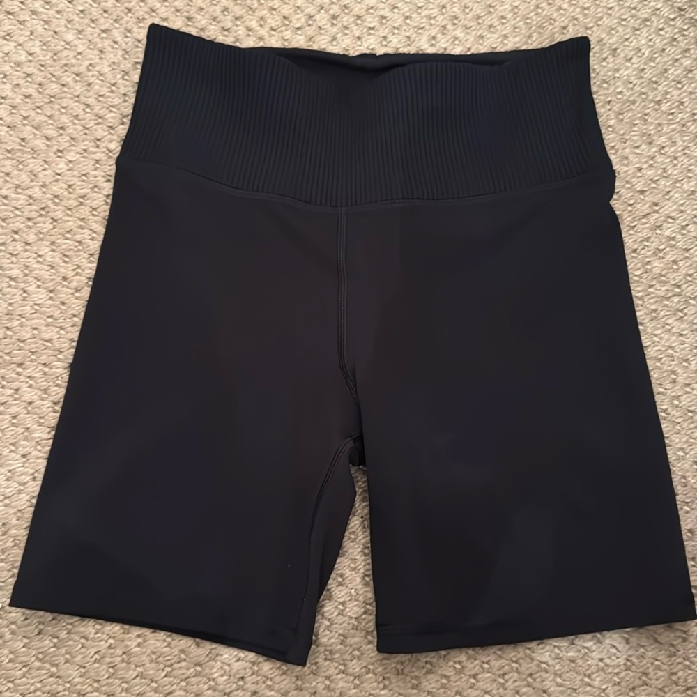 Vuori high waisted, black athletic tight fitting shorts. Size small. NWOT.